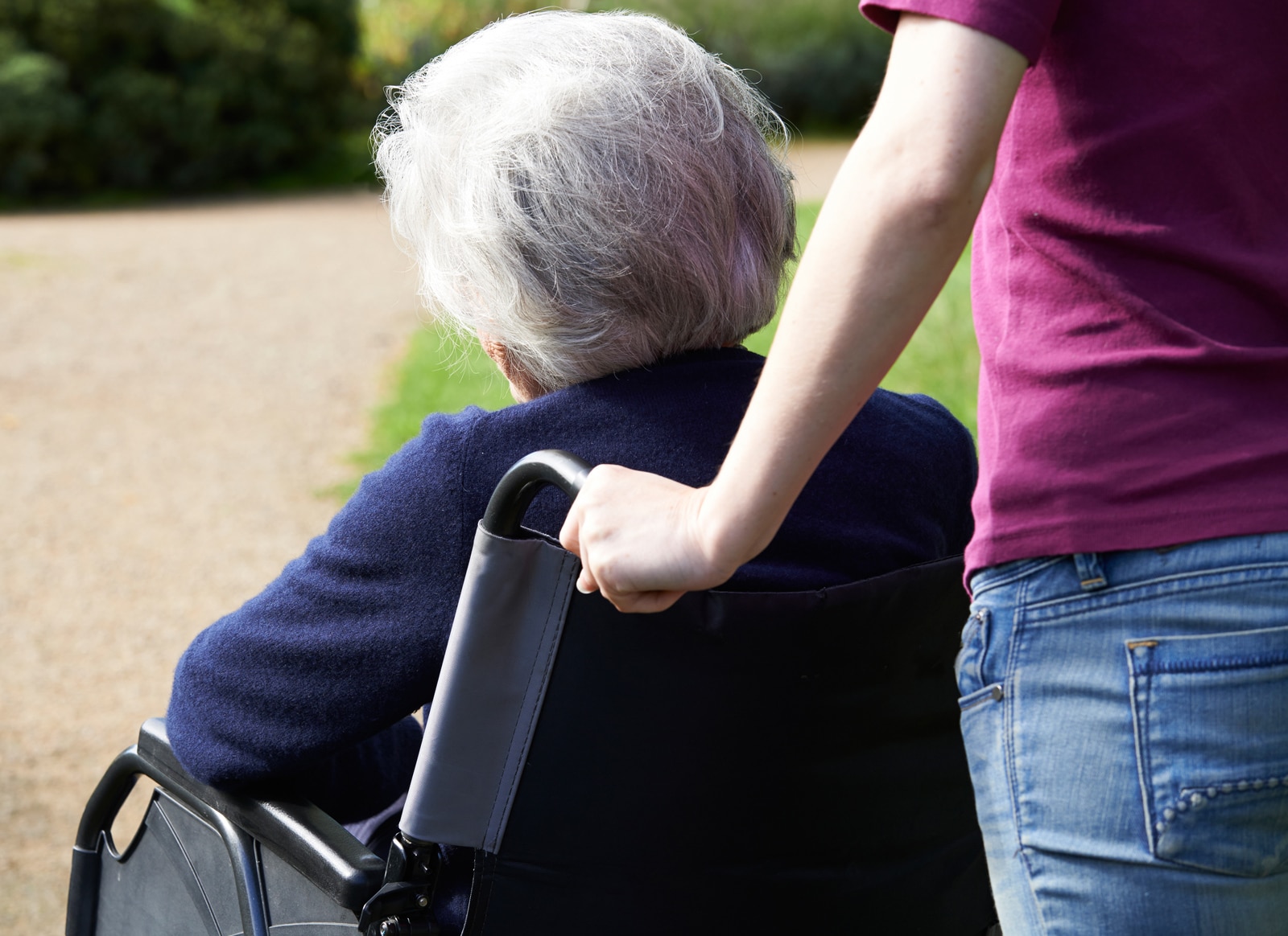 An elderly woman with dementia in wheechair