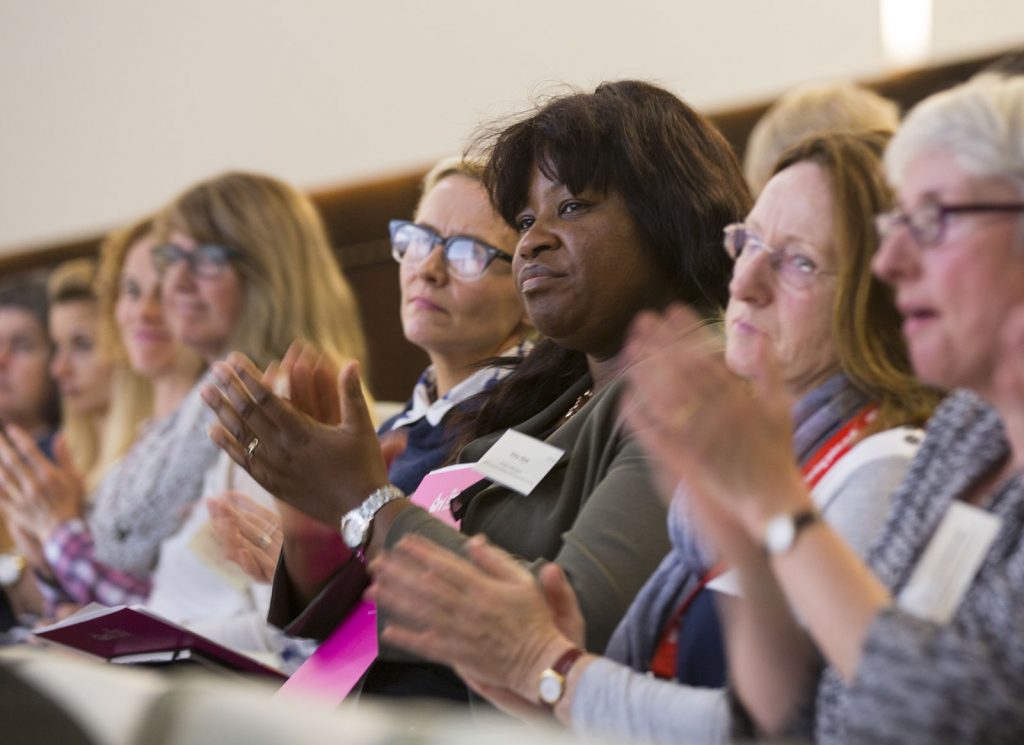 Delegates clap at the Homeless Health Conference